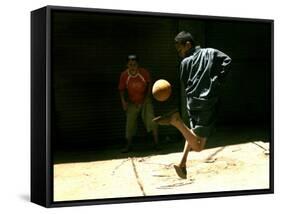 An Egyptian Boy Shows off His Ball Skill as He Plays Soccer with a Friend on the Steets of Cairo-null-Framed Stretched Canvas