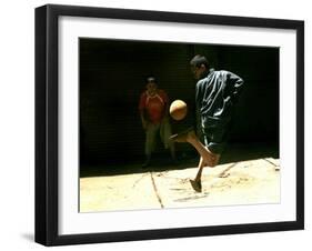 An Egyptian Boy Shows off His Ball Skill as He Plays Soccer with a Friend on the Steets of Cairo-null-Framed Premium Photographic Print