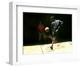 An Egyptian Boy Shows off His Ball Skill as He Plays Soccer with a Friend on the Steets of Cairo-null-Framed Photographic Print