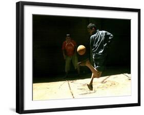 An Egyptian Boy Shows off His Ball Skill as He Plays Soccer with a Friend on the Steets of Cairo-null-Framed Photographic Print