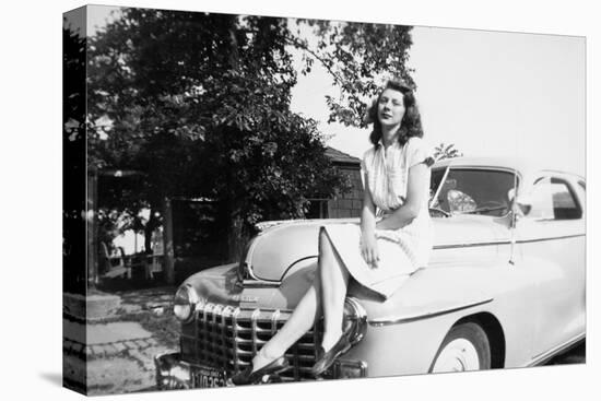 An Eighteen Year Old Woman Poses on the Hood Her Car, Ca. 1947-null-Stretched Canvas