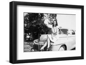 An Eighteen Year Old Woman Poses on the Hood Her Car, Ca. 1947-null-Framed Photographic Print
