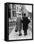 An Elderly Couple Walking Down the Street, Arm in Arm-Henry Grant-Framed Stretched Canvas