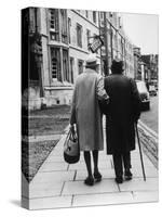 An Elderly Couple Walking Down the Street, Arm in Arm-Henry Grant-Stretched Canvas