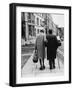 An Elderly Couple Walking Down the Street, Arm in Arm-Henry Grant-Framed Photographic Print