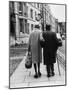 An Elderly Couple Walking Down the Street, Arm in Arm-Henry Grant-Mounted Photographic Print