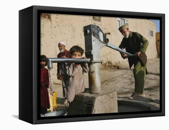 An Elderly Man Pumps Water from a Public Well in Kabul, Afghanistan, Friday, September 22, 2006-Rodrigo Abd-Framed Stretched Canvas