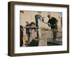 An Elderly Man Pumps Water from a Public Well in Kabul, Afghanistan, Friday, September 22, 2006-Rodrigo Abd-Framed Photographic Print