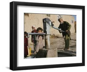 An Elderly Man Pumps Water from a Public Well in Kabul, Afghanistan, Friday, September 22, 2006-Rodrigo Abd-Framed Photographic Print
