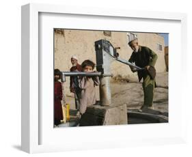 An Elderly Man Pumps Water from a Public Well in Kabul, Afghanistan, Friday, September 22, 2006-Rodrigo Abd-Framed Photographic Print