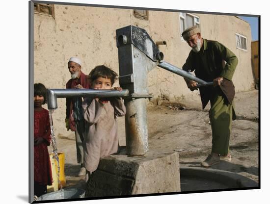 An Elderly Man Pumps Water from a Public Well in Kabul, Afghanistan, Friday, September 22, 2006-Rodrigo Abd-Mounted Photographic Print