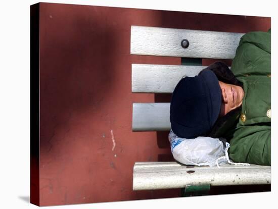 An Elderly Man Sleeps on a Bench Near Beijing's Tiananmen Square-null-Stretched Canvas