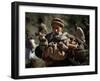 An Elderly Pakistani Earthquake Survivor Rushes Towards a Helicopter Carrying a Child in His Arms-null-Framed Photographic Print