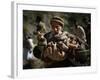 An Elderly Pakistani Earthquake Survivor Rushes Towards a Helicopter Carrying a Child in His Arms-null-Framed Photographic Print