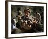 An Elderly Pakistani Earthquake Survivor Rushes Towards a Helicopter Carrying a Child in His Arms-null-Framed Photographic Print