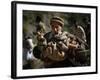 An Elderly Pakistani Earthquake Survivor Rushes Towards a Helicopter Carrying a Child in His Arms-null-Framed Photographic Print