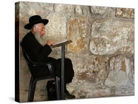 An Elderly Ultra-Orthodox Jew Prays at the Western Wall Plaza-null-Stretched Canvas