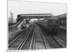 An Electric Train at Raynes Park Station Surrey England-null-Mounted Art Print