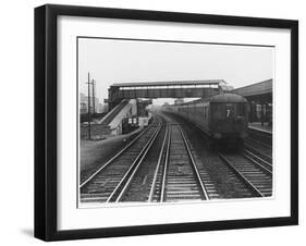 An Electric Train at Raynes Park Station Surrey England-null-Framed Art Print