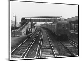 An Electric Train at Raynes Park Station Surrey England-null-Mounted Art Print