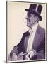 An Elegant Gentleman in Top Hat Smoking a Cigarette-null-Mounted Art Print