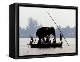 An Elephant is Taken on a Small Boat to a Temple Festival-null-Framed Stretched Canvas