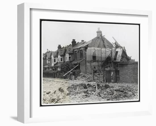 An End-Of-Terrace in Surrey Virtually Obliterated after a German Air Raid-null-Framed Art Print