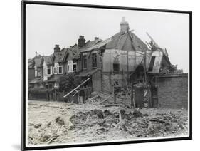 An End-Of-Terrace in Surrey Virtually Obliterated after a German Air Raid-null-Mounted Art Print