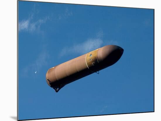 An External Fuel Tank Backdropped by a Blue And White Part of Earth-Stocktrek Images-Mounted Photographic Print