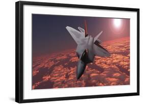 An F-22 Fighter Jet Flies at an Altitude Above the Cloud Layer on its Mission-null-Framed Art Print