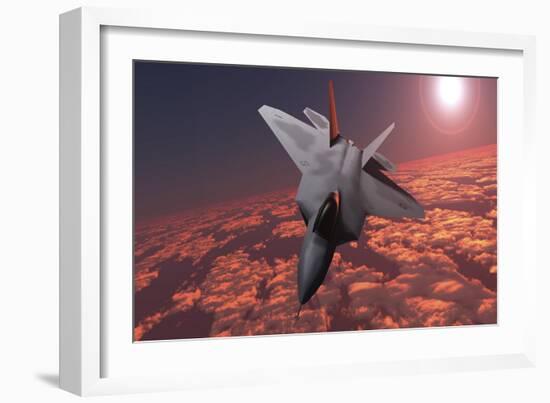 An F-22 Fighter Jet Flies at an Altitude Above the Cloud Layer on its Mission-null-Framed Art Print