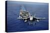 An F-A-18E Super Hornet Flying Above USS John C. Stennis-null-Stretched Canvas