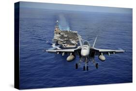 An F-A-18E Super Hornet Flying Above USS John C. Stennis-null-Stretched Canvas