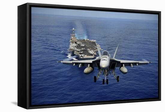 An F-A-18E Super Hornet Flying Above USS John C. Stennis-null-Framed Stretched Canvas