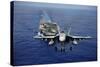 An F-A-18E Super Hornet Flying Above USS John C. Stennis-null-Stretched Canvas