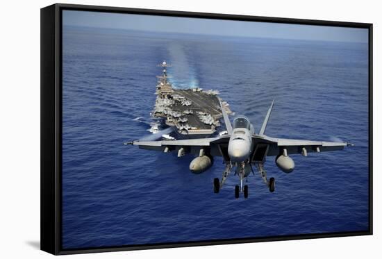 An F-A-18E Super Hornet Flying Above USS John C. Stennis-null-Framed Stretched Canvas