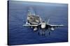 An F-A-18E Super Hornet Flying Above USS John C. Stennis-null-Stretched Canvas