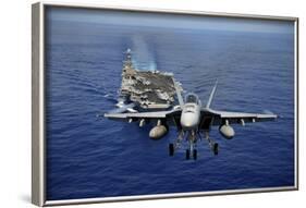 An F-A-18E Super Hornet Flying Above USS John C. Stennis-null-Framed Photographic Print