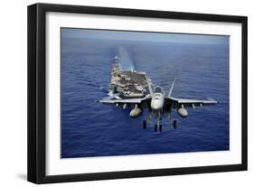 An F-A-18E Super Hornet Flying Above USS John C. Stennis-null-Framed Photographic Print