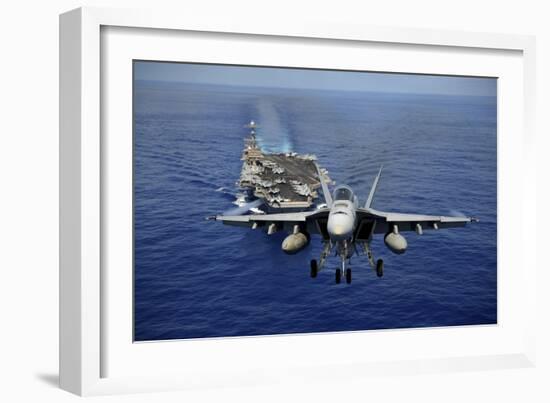 An F-A-18E Super Hornet Flying Above USS John C. Stennis-null-Framed Photographic Print