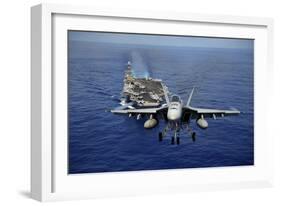 An F-A-18E Super Hornet Flying Above USS John C. Stennis-null-Framed Photographic Print