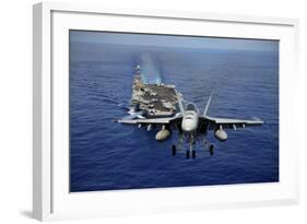 An F-A-18E Super Hornet Flying Above USS John C. Stennis-null-Framed Photographic Print