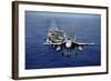 An F-A-18E Super Hornet Flying Above USS John C. Stennis-null-Framed Photographic Print