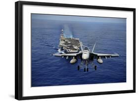 An F-A-18E Super Hornet Flying Above USS John C. Stennis-null-Framed Photographic Print