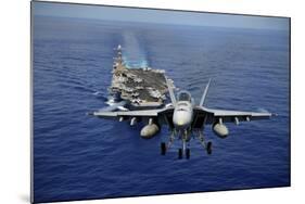 An F-A-18E Super Hornet Flying Above USS John C. Stennis-null-Mounted Photographic Print