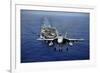 An F-A-18E Super Hornet Flying Above USS John C. Stennis-null-Framed Photographic Print