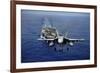 An F-A-18E Super Hornet Flying Above USS John C. Stennis-null-Framed Photographic Print