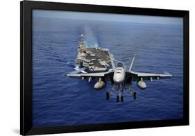 An F-A-18E Super Hornet Flying Above USS John C. Stennis-null-Framed Photographic Print