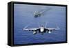 An F-A-18E Super Hornet Flying Above USS John C. Stennis-null-Framed Stretched Canvas