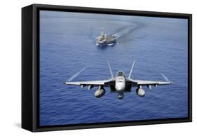 An F-A-18E Super Hornet Flying Above USS John C. Stennis-null-Framed Stretched Canvas